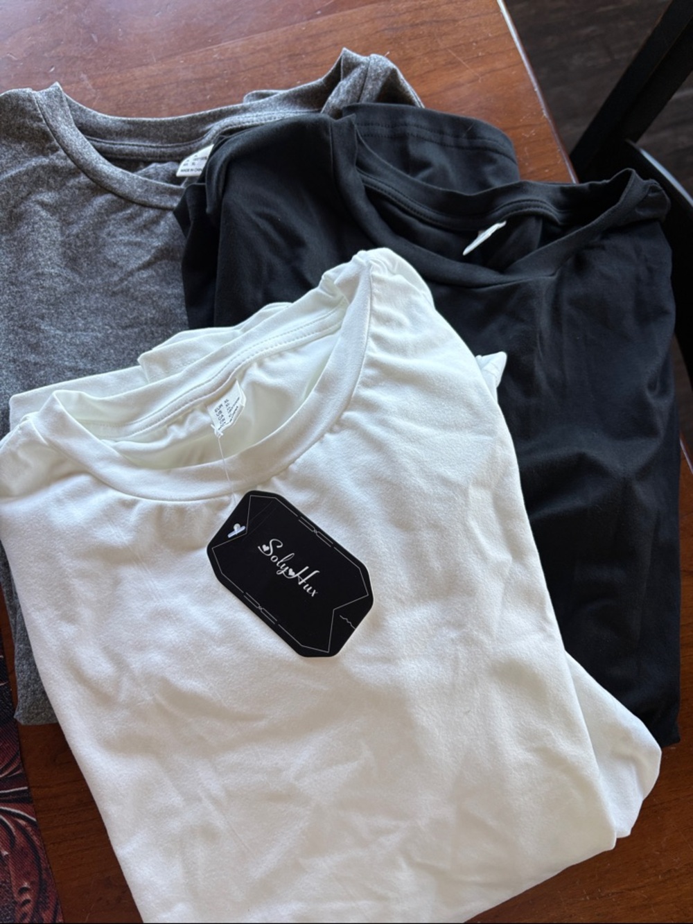 3 tops black white and gray. Size xl new with tags long sleeve